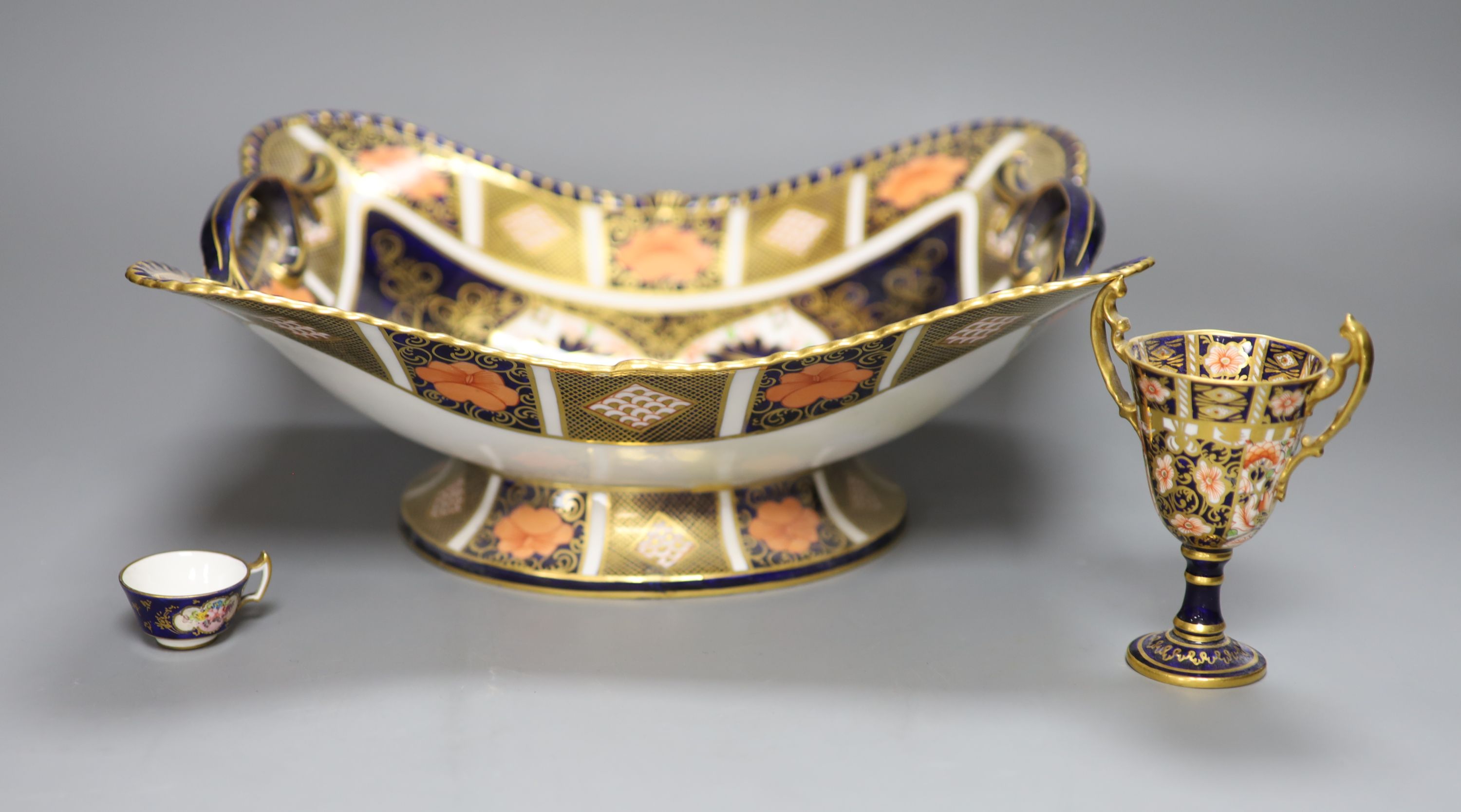 A Royal Crown Derby dish, a vase and a cup, tallest 30cm (all a.f.)